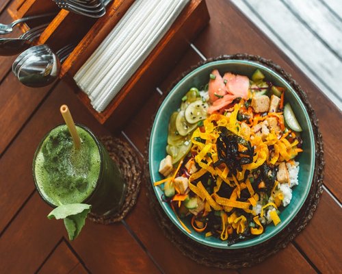 A healthy balanced bowl of food on a wooden table